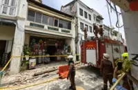 Fire and Rescue personnel inspecting the collapsed heritage building on Armenian Street, Penang