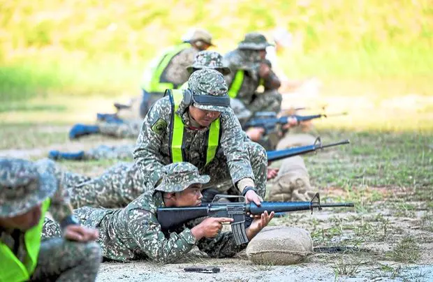 A filepic of National Service 3.0 programme trainees during the firearms shooting exercise at Kem Perdana Sungai Besi in Kuala Lumpur.