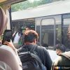 Passengers being moved to another train following the power outage which left their train stranded on the tracks.